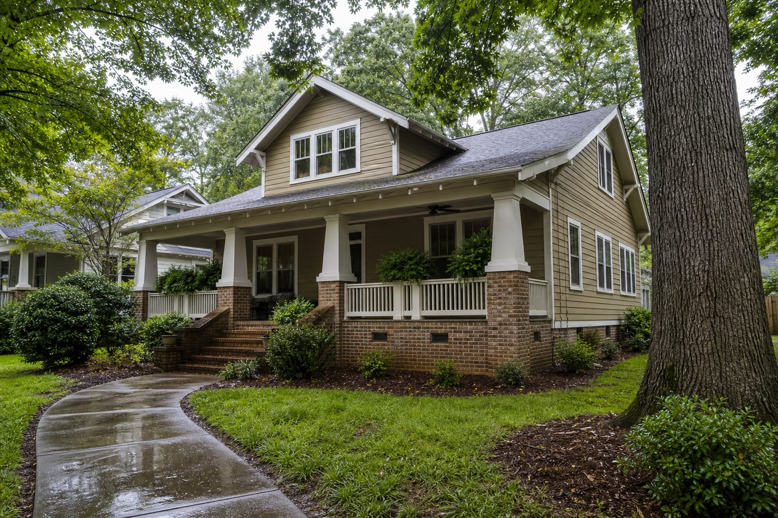 Established craftsman home with brick crawl space vents beneath mature trees