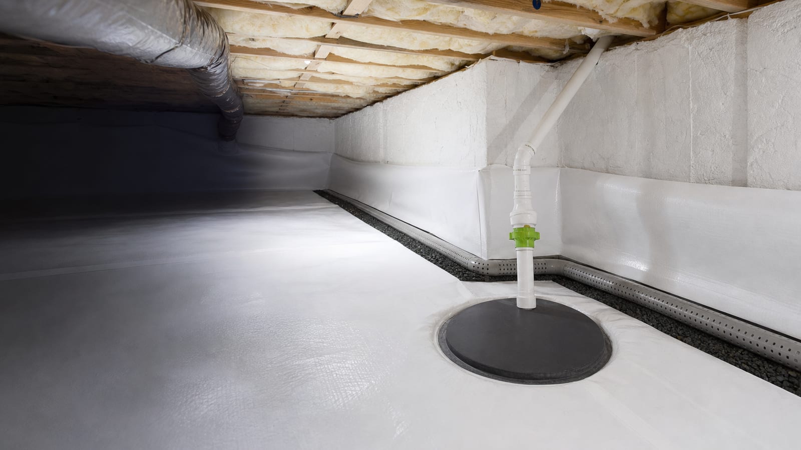 Finished crawl space drainage detail in a clean sealed space