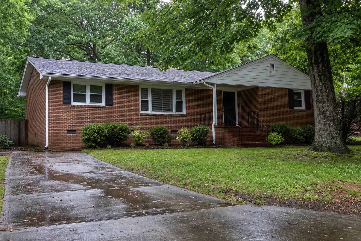Established brick split-level home with a crawl space foundation and mature oak trees